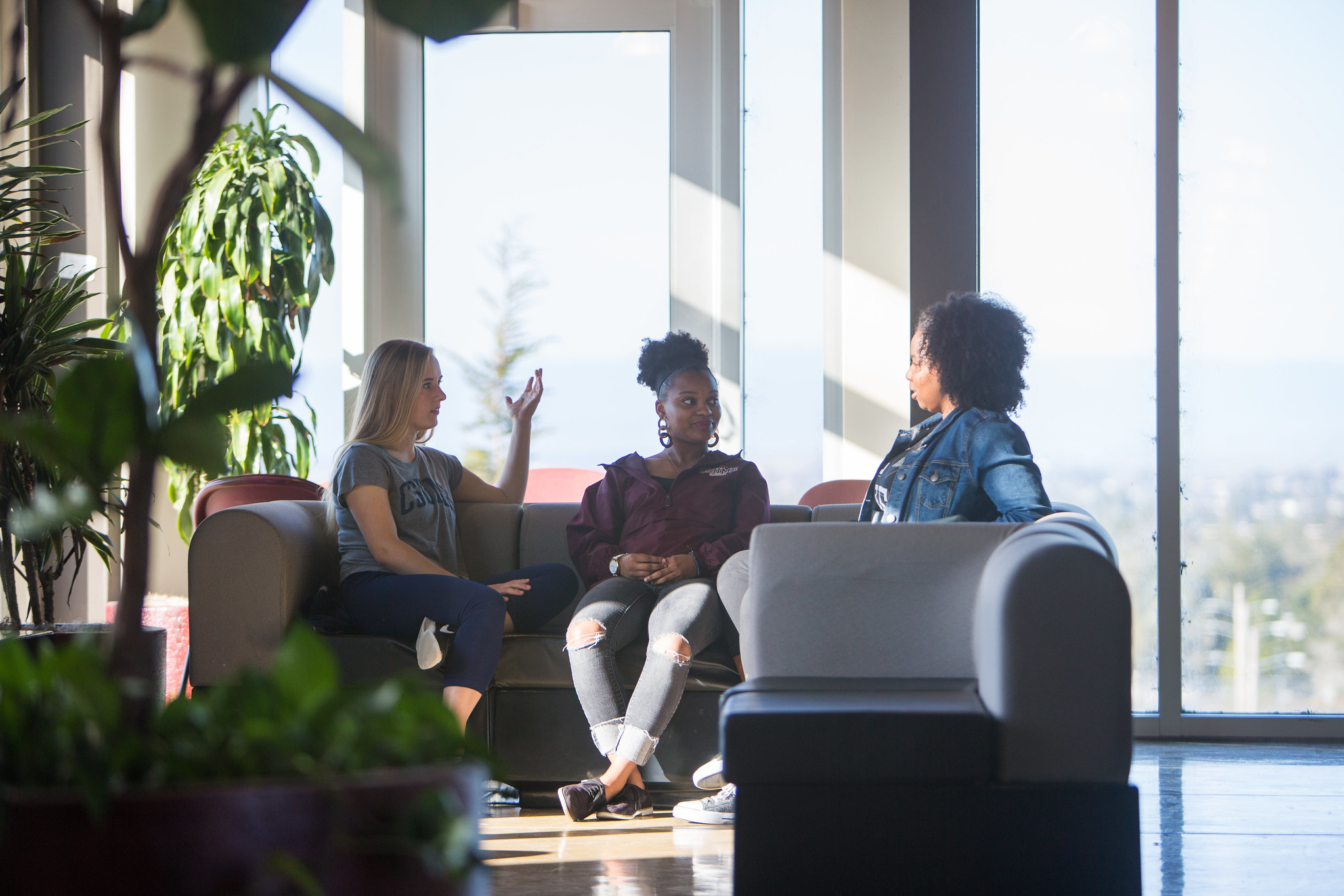 Three students on a couch