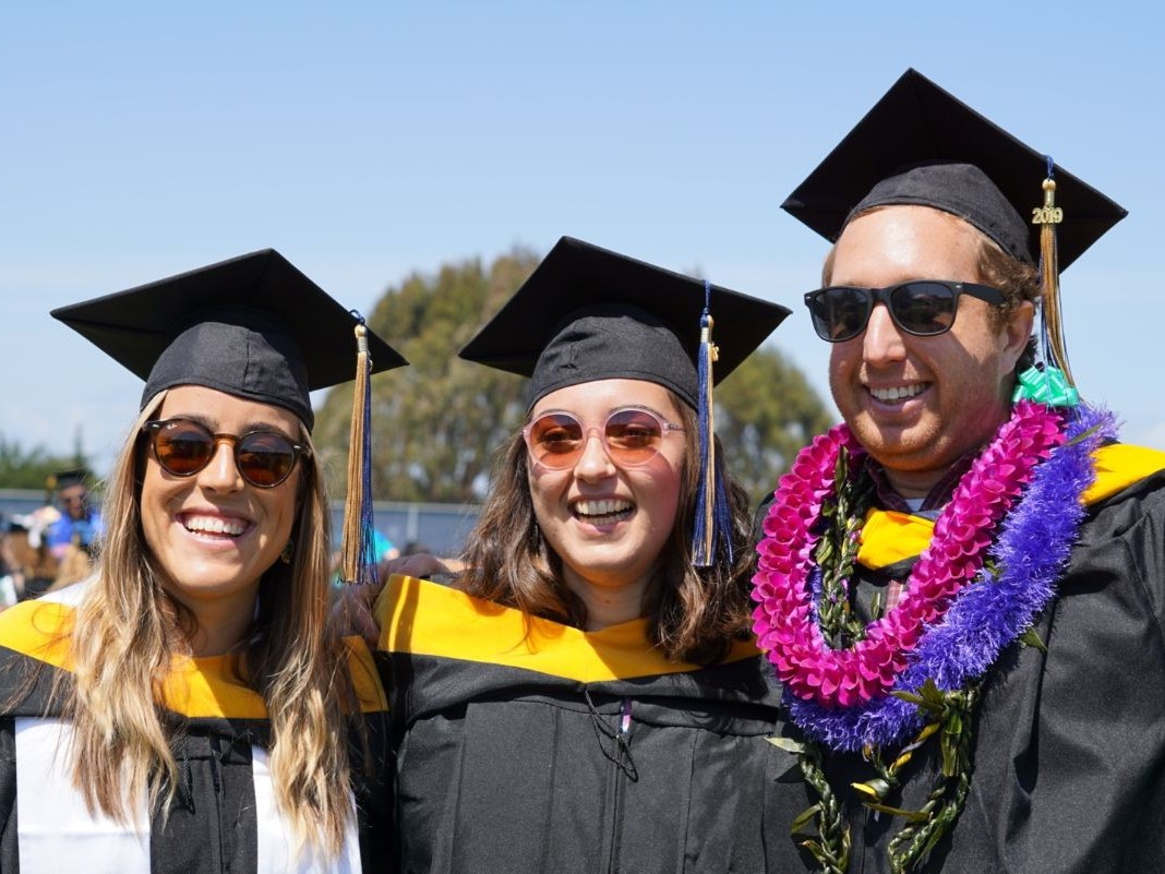Students smiling at graduation
