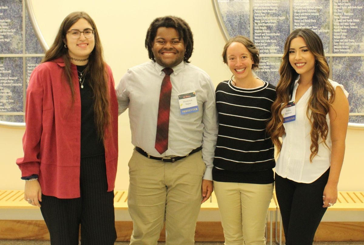 UROC Researchers stand with Dr. Jennifer Lovell at the 2019 Fall Showcase